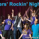 Foreigner's Kelly Hansen up front with Lemoore High School's choir during a concert Thursday night at Visalia's Fox Theater.
